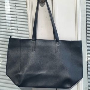 Black faux leather bag from Bath and Body Works.